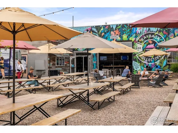 a group of people sitting outside of a building