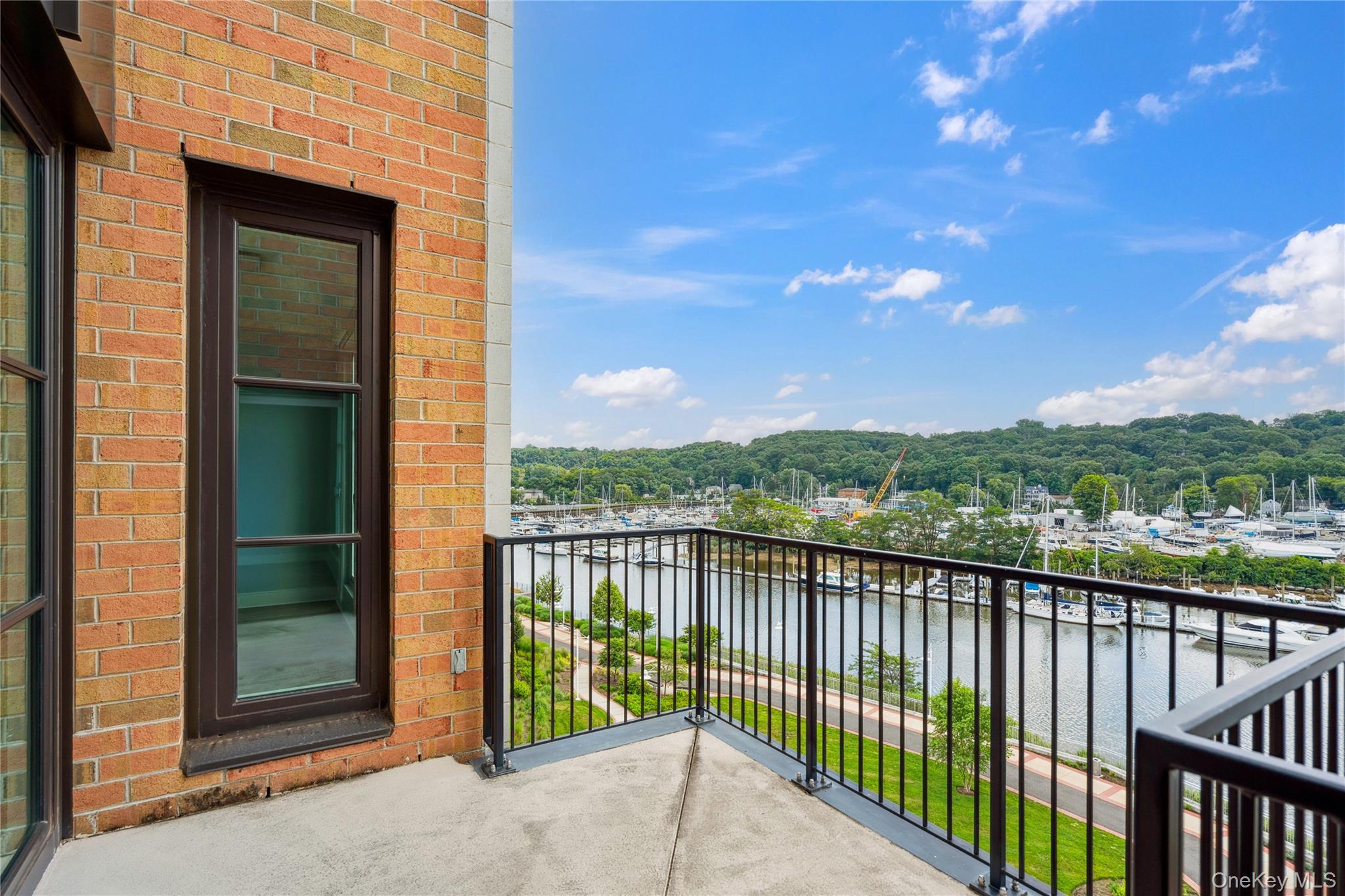 100 Garvies Point Road, Unit 1304 Glen Cove, NY 11542 - Photo 15 of 34 Balcony with a water view