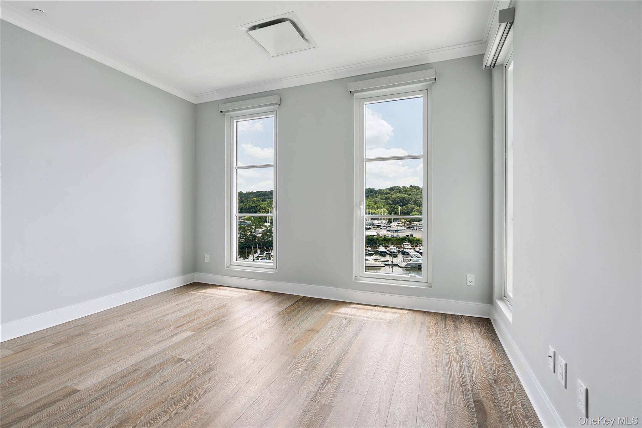 100 Garvies Point Road, Unit 1304 Glen Cove, NY 11542 - Photo 17 of 34 Bedroom with en-suite bathroom