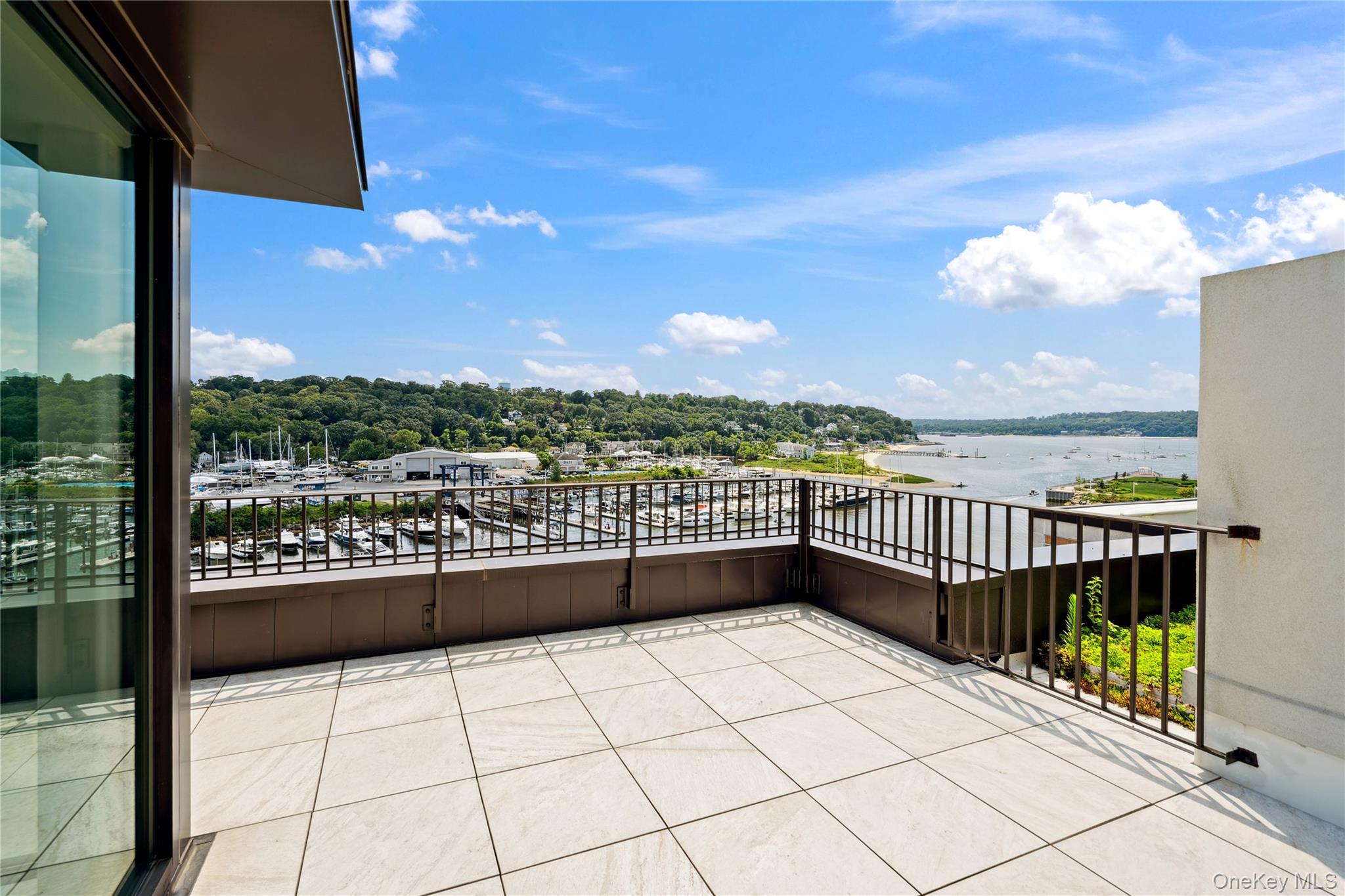 100 Garvies Point Road, Unit 1304 Glen Cove, NY 11542 - Photo 23 of 34 Balcony with a water view