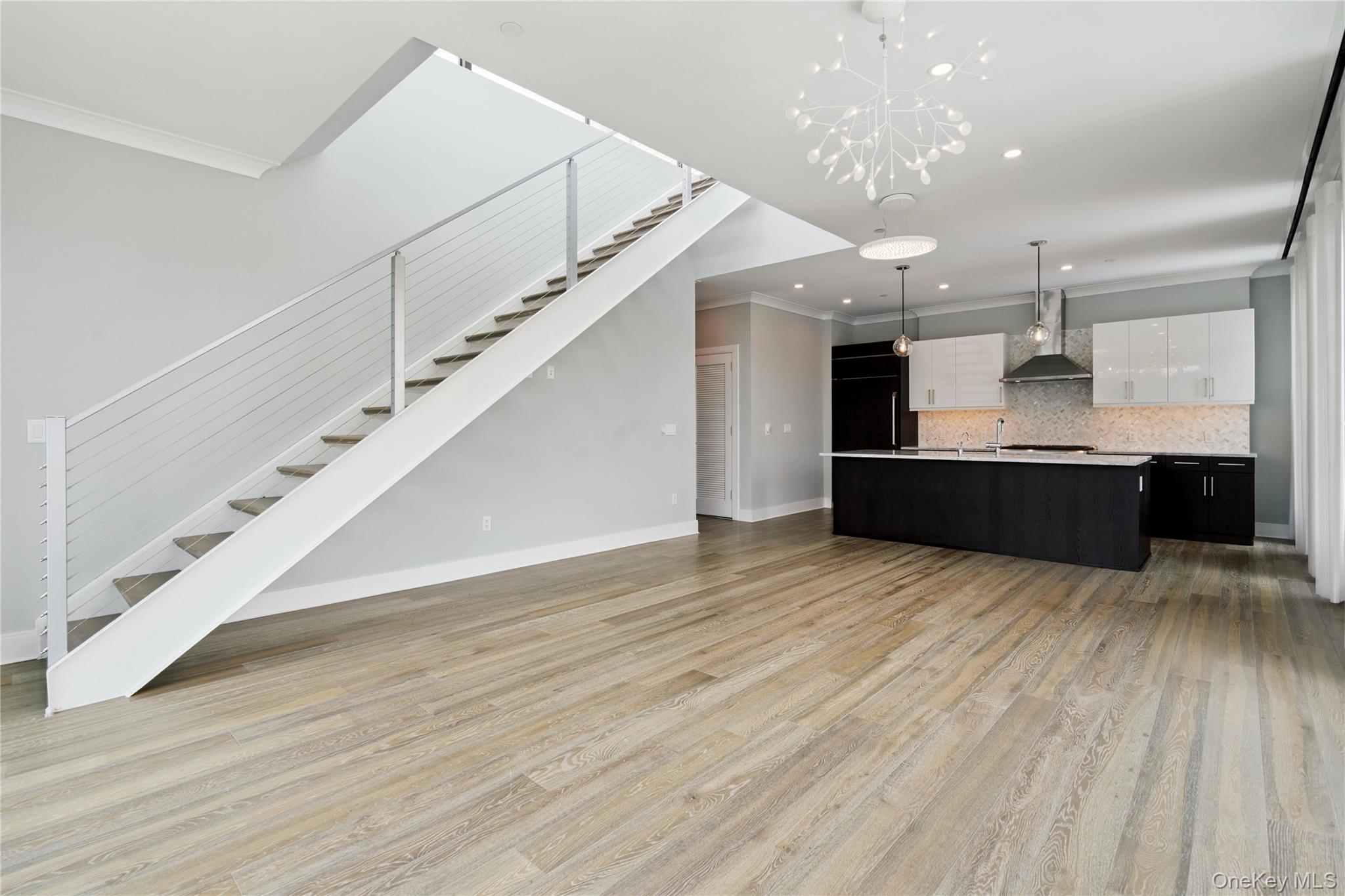 100 Garvies Point Road, Unit 1304 Glen Cove, NY 11542 - Photo 4 of 34 Living room and Kitchen
