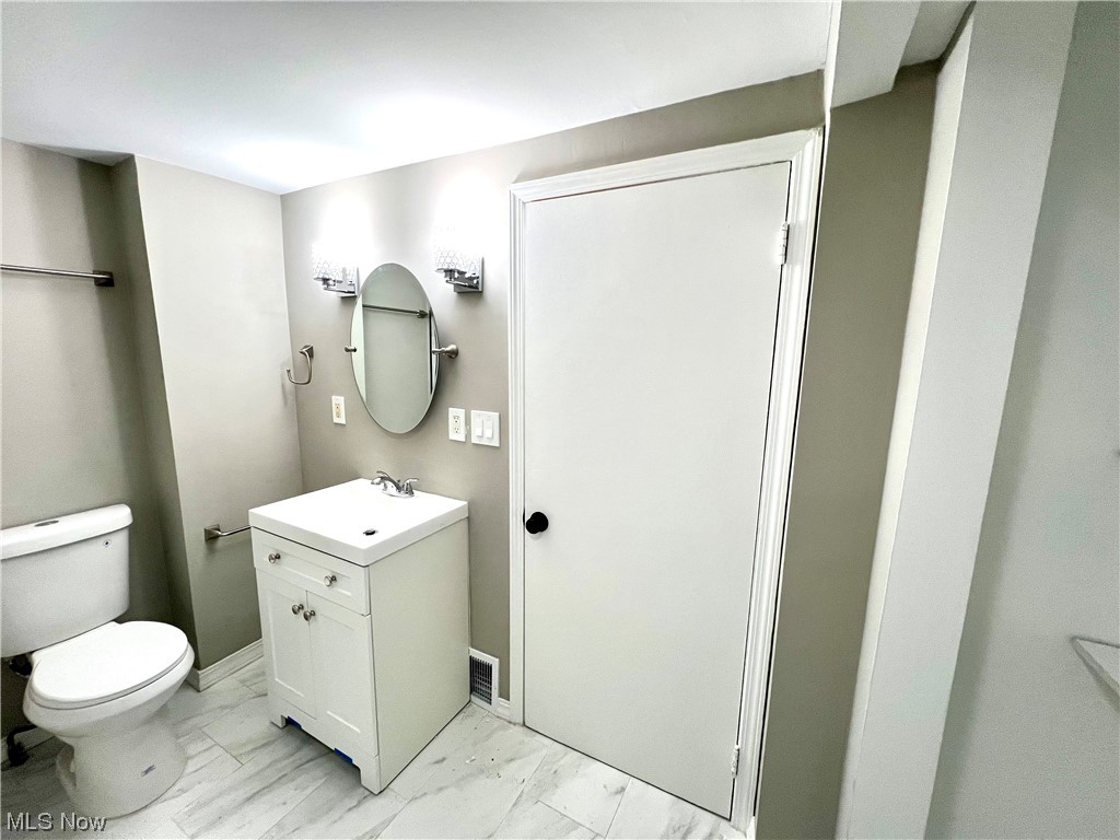 3527 Broadview Road Cleveland, OH 44109 - Photo 17 of 29 Bathroom with vanity, toilet, and tile floors
