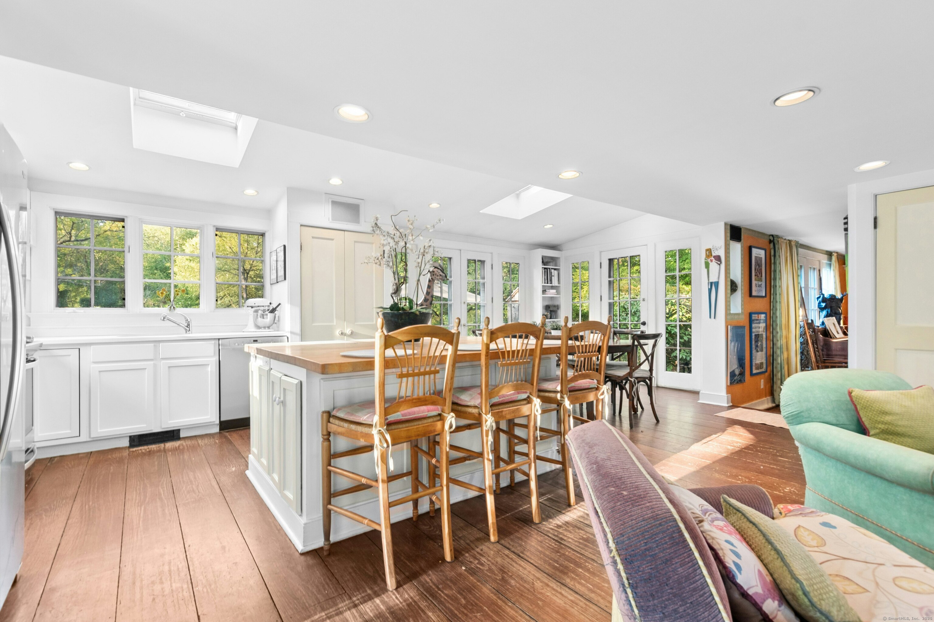 561 Middlesex Road Darien, CT 06820 - Photo 13 of 33 a dining room with furniture window and wooden floor