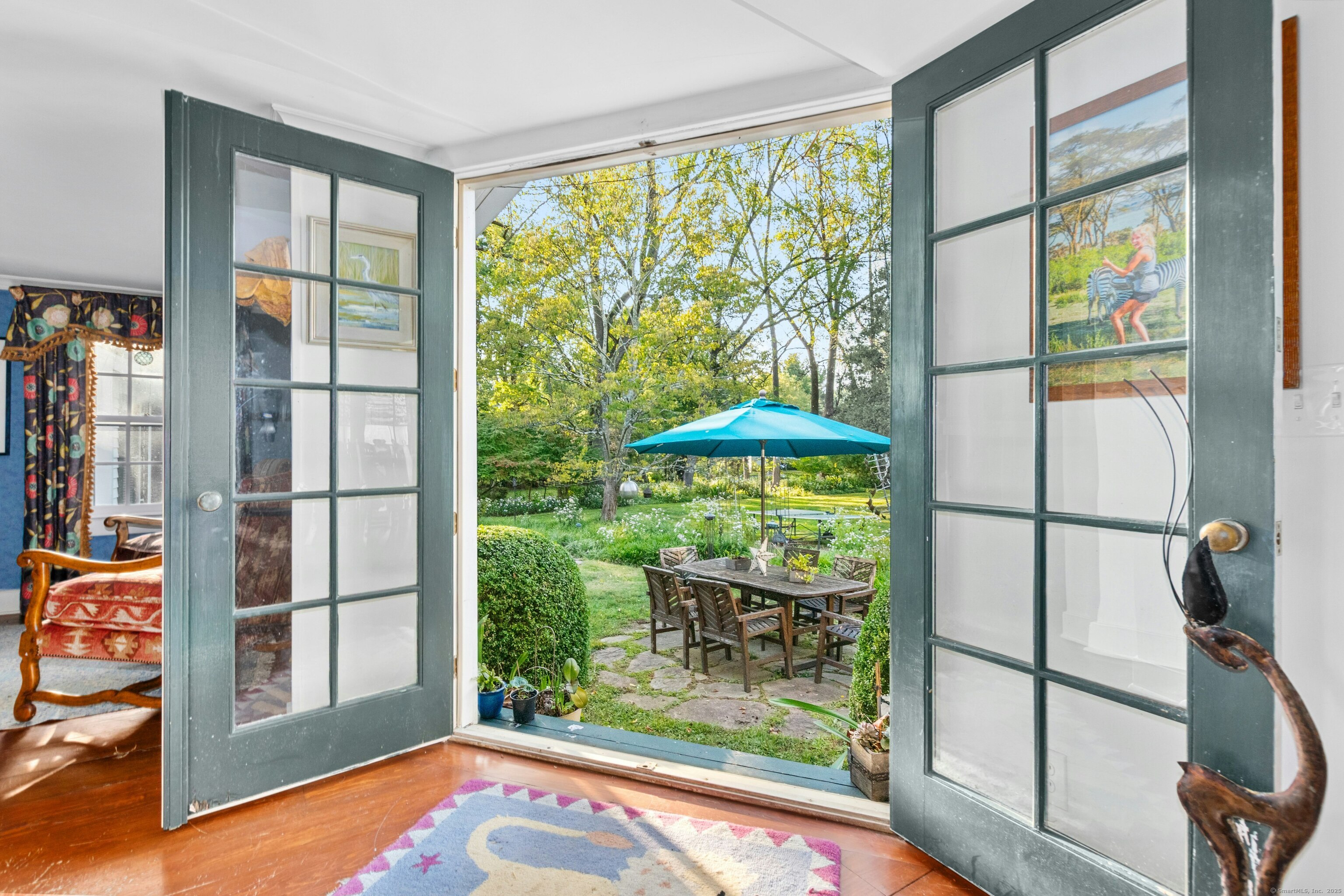 561 Middlesex Road Darien, CT 06820 - Photo 17 of 33 a view of a porch with furniture and backyard