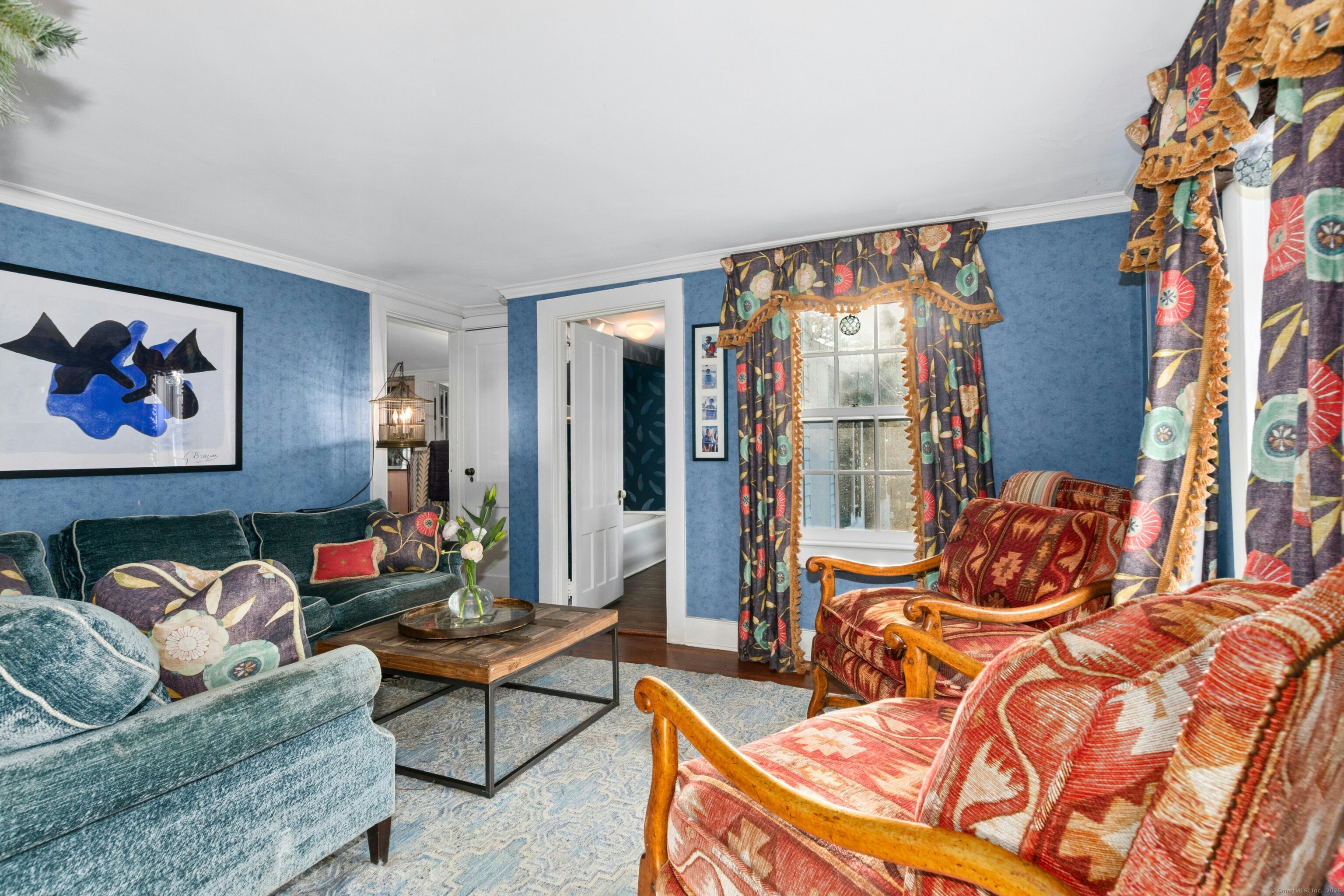 561 Middlesex Road Darien, CT 06820 - Photo 18 of 33 a living room with blue lights with furniture and a large window