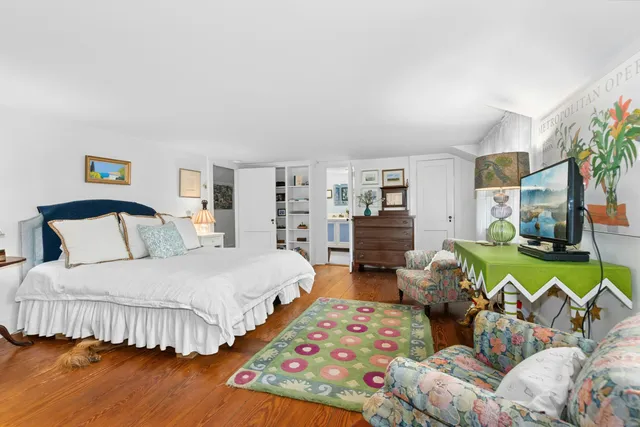 a bedroom with bed and a couch