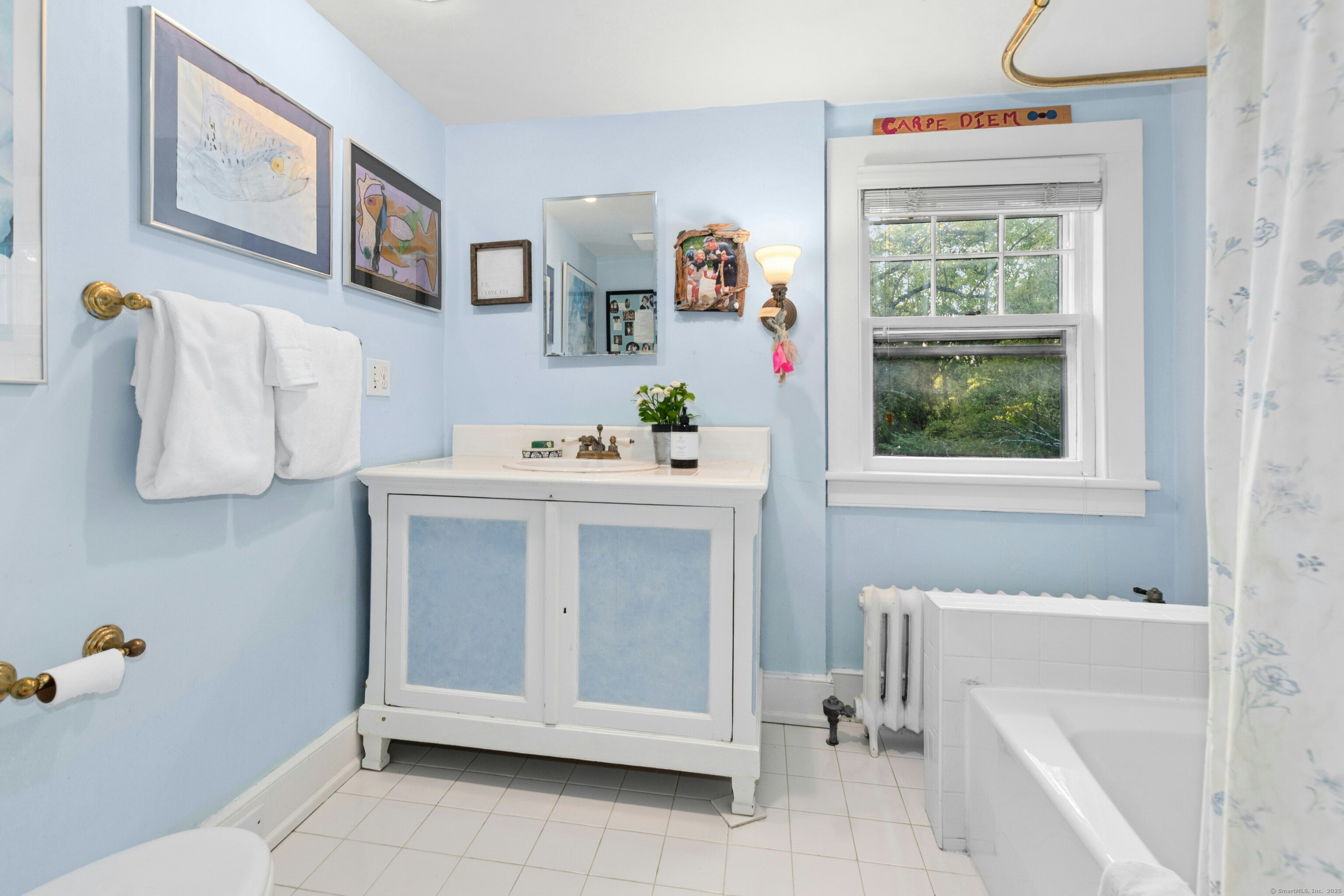 561 Middlesex Road Darien, CT 06820 - Photo 22 of 33 a utility room with a window dryer and washer