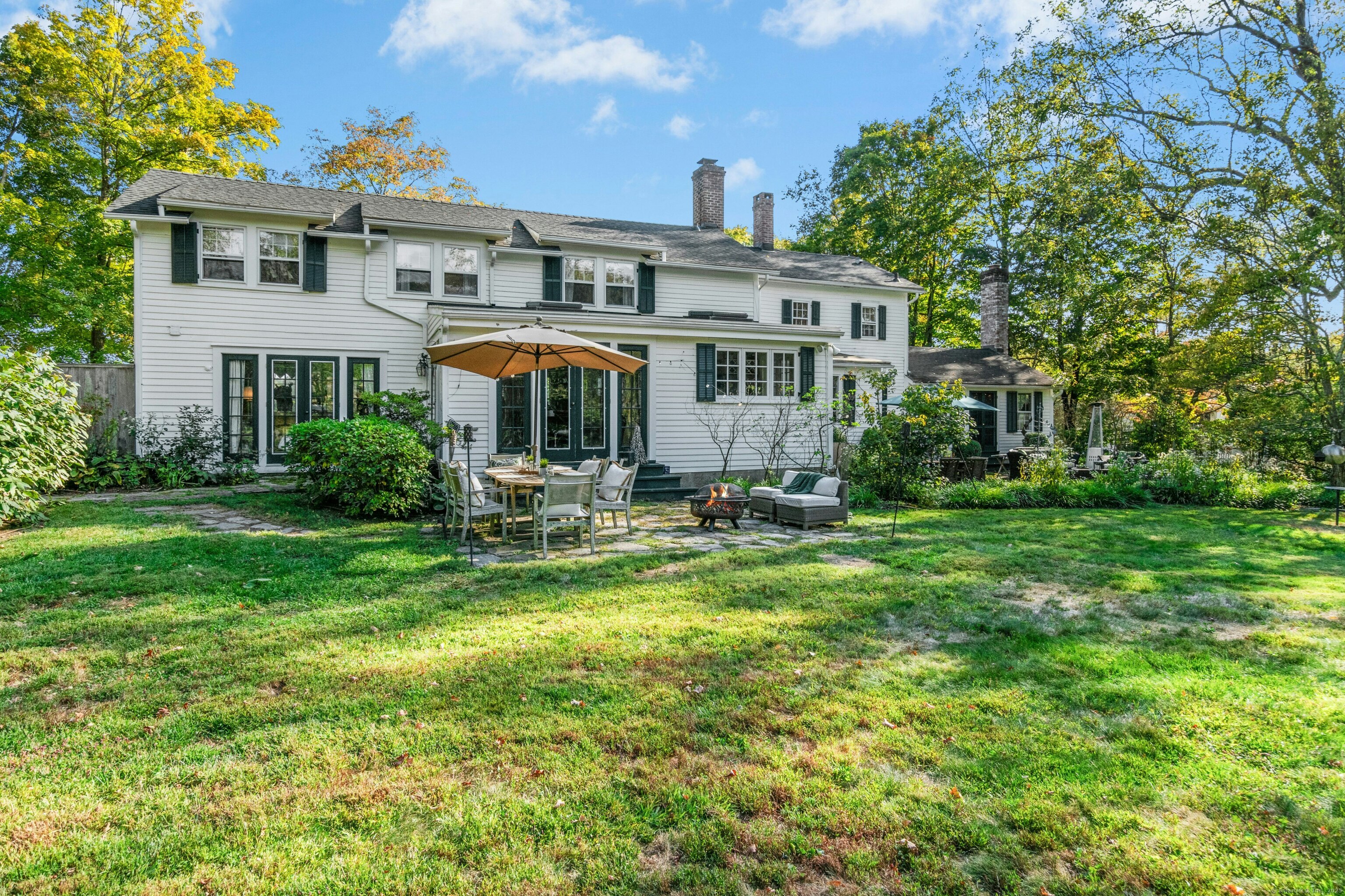 561 Middlesex Road Darien, CT 06820 - Photo 29 of 33 a front view of a house with yard and green space