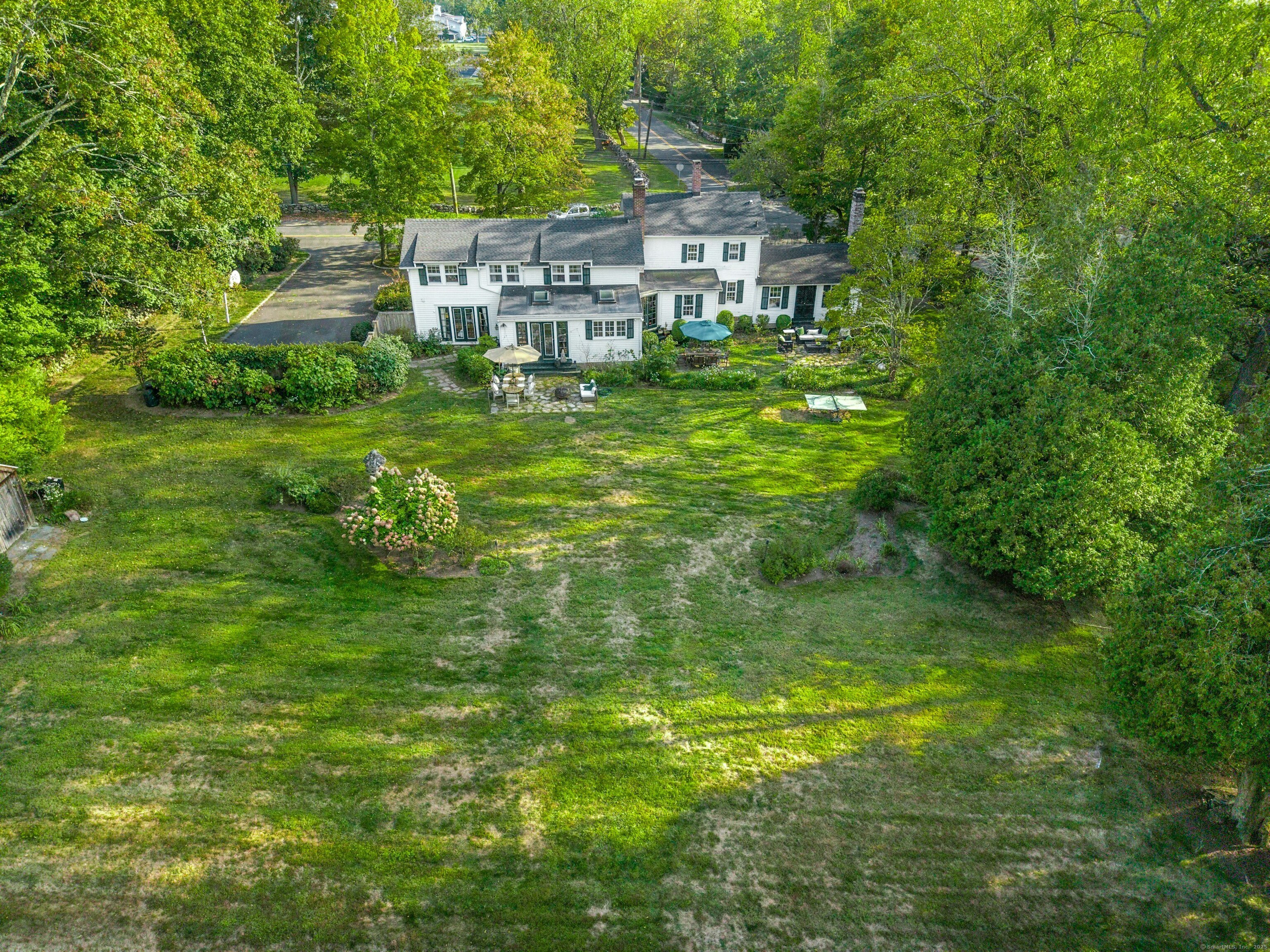 561 Middlesex Road Darien, CT 06820 - Photo 31 of 33 a aerial view of a house with a yard