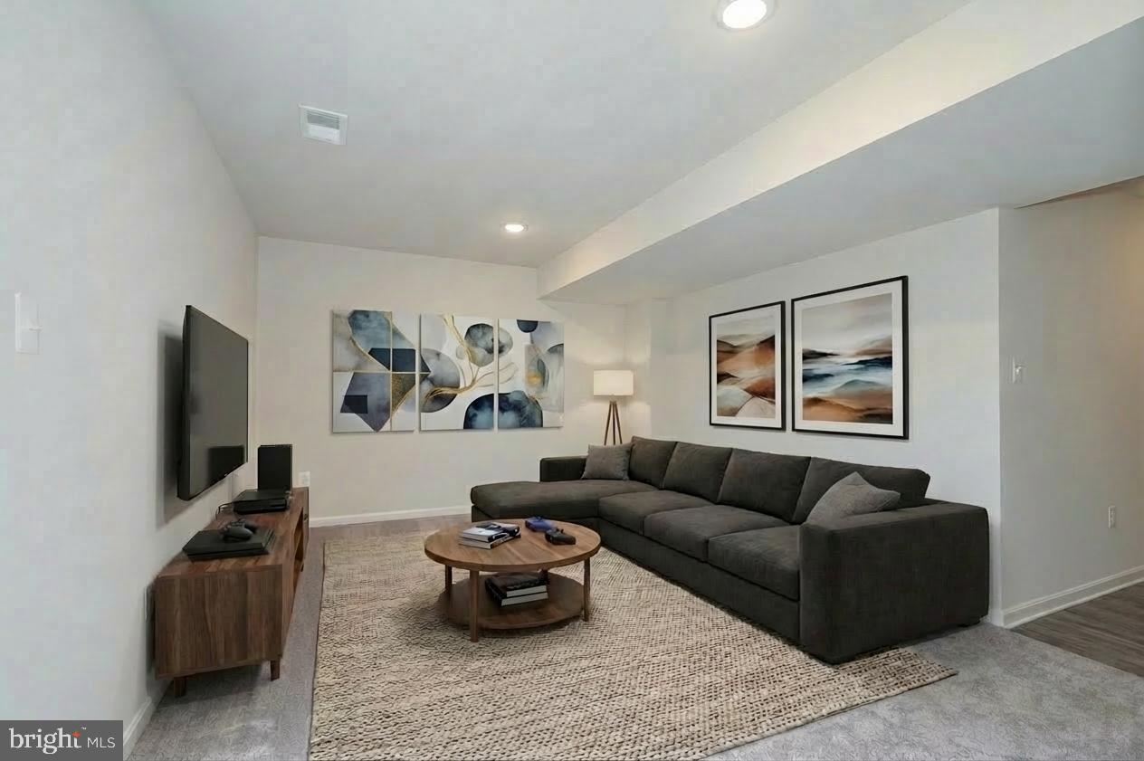 164 Rabbit Road Hedgesville, WV 25427 - Photo 11 of 42 a living room with furniture and a flat screen tv