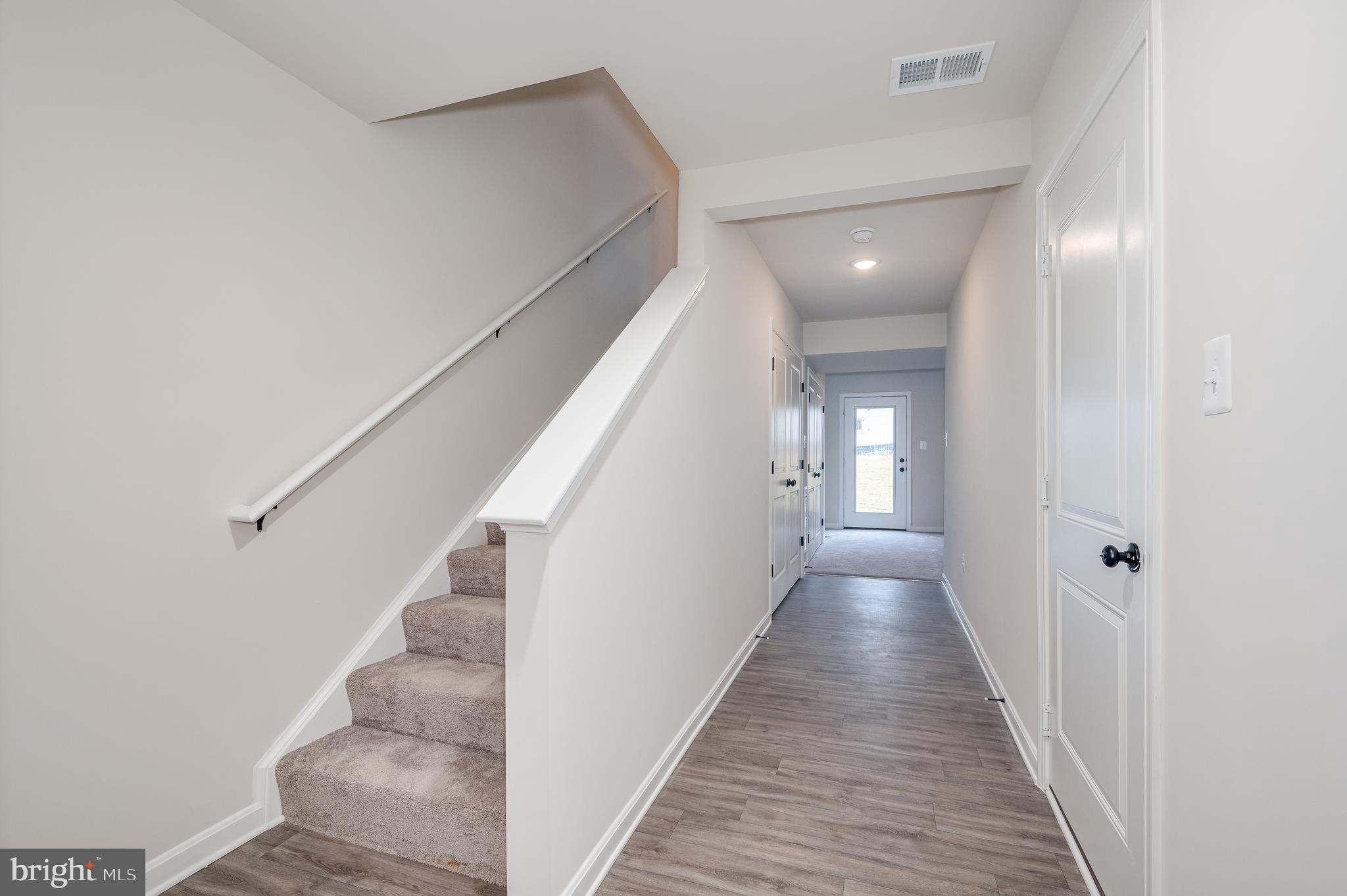 164 Rabbit Road Hedgesville, WV 25427 - Photo 14 of 42 a view of a hallway with wooden floor and entryway
