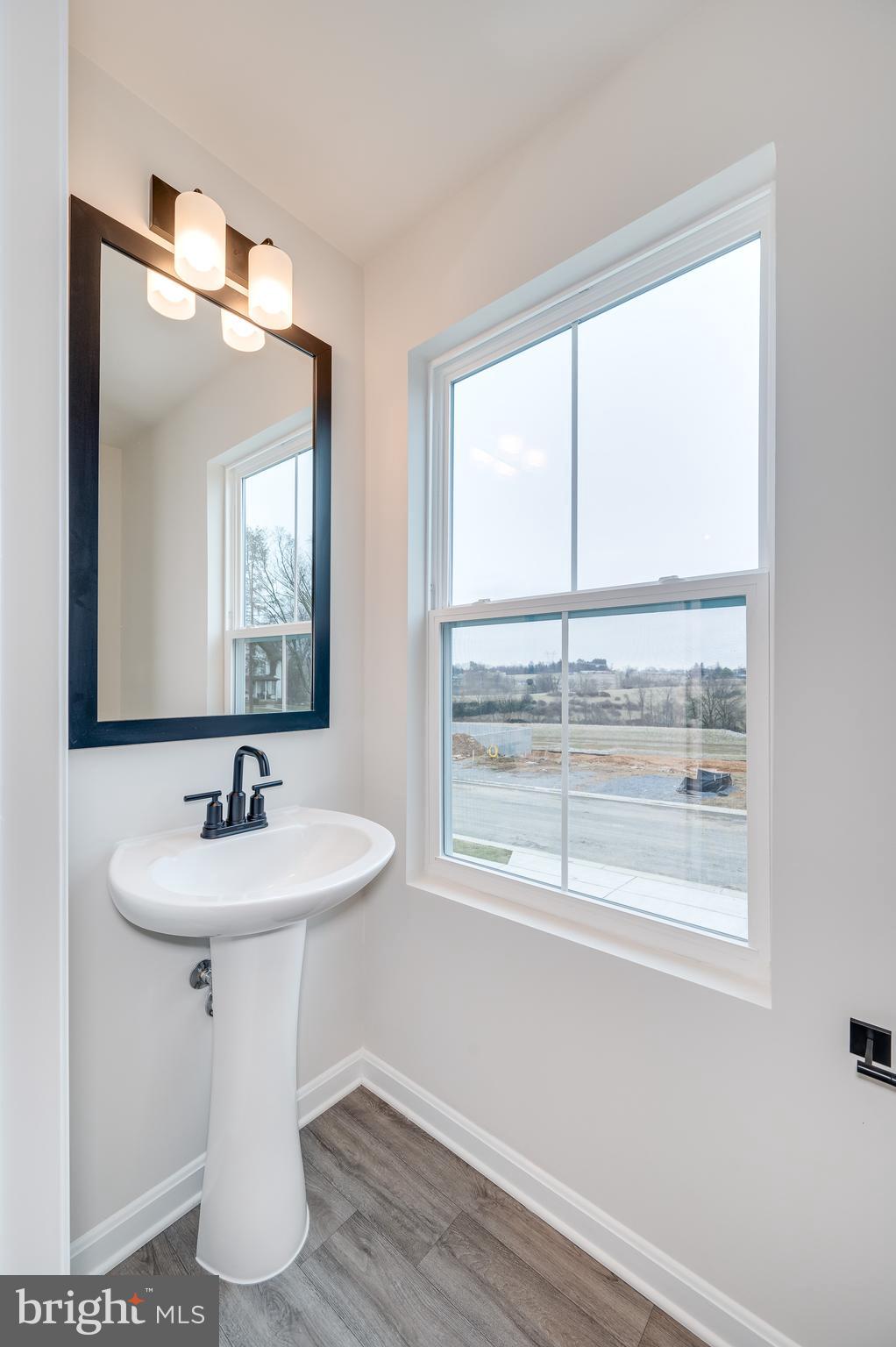 164 Rabbit Road Hedgesville, WV 25427 - Photo 27 of 42 a bathroom with a sink and a mirror