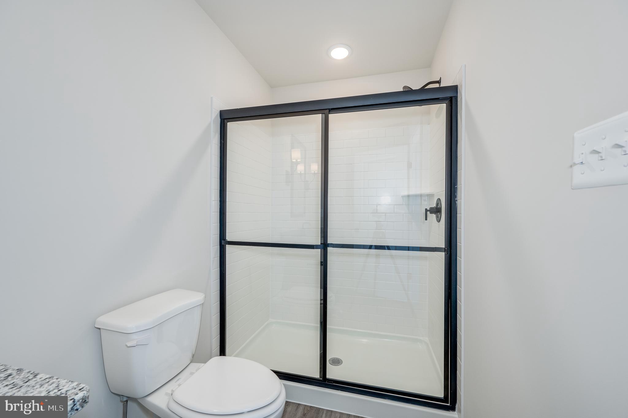 164 Rabbit Road Hedgesville, WV 25427 - Photo 34 of 42 a bathroom with a toilet a sink and a shower