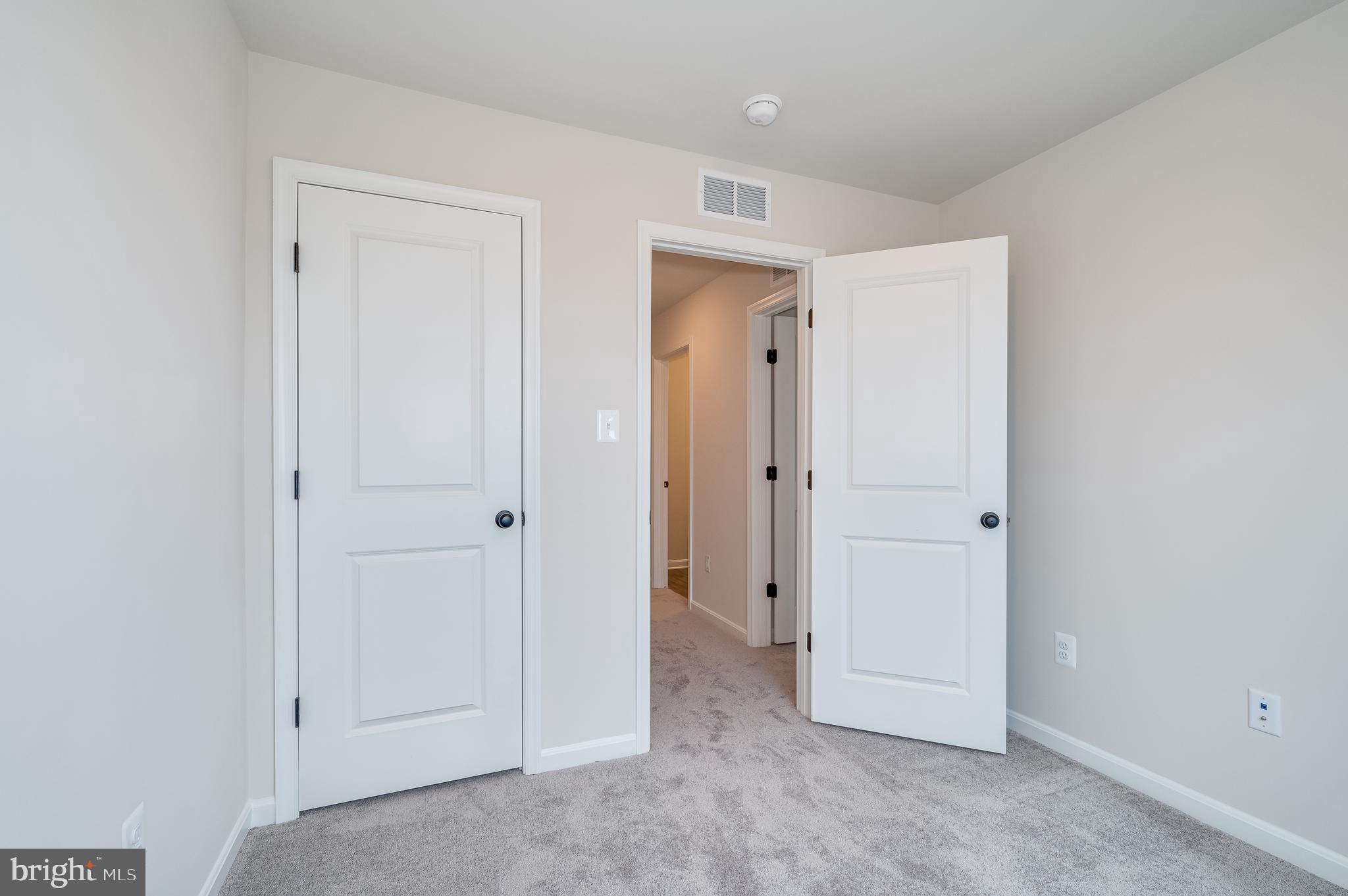 164 Rabbit Road Hedgesville, WV 25427 - Photo 36 of 42 an empty room with closet and a bathroom