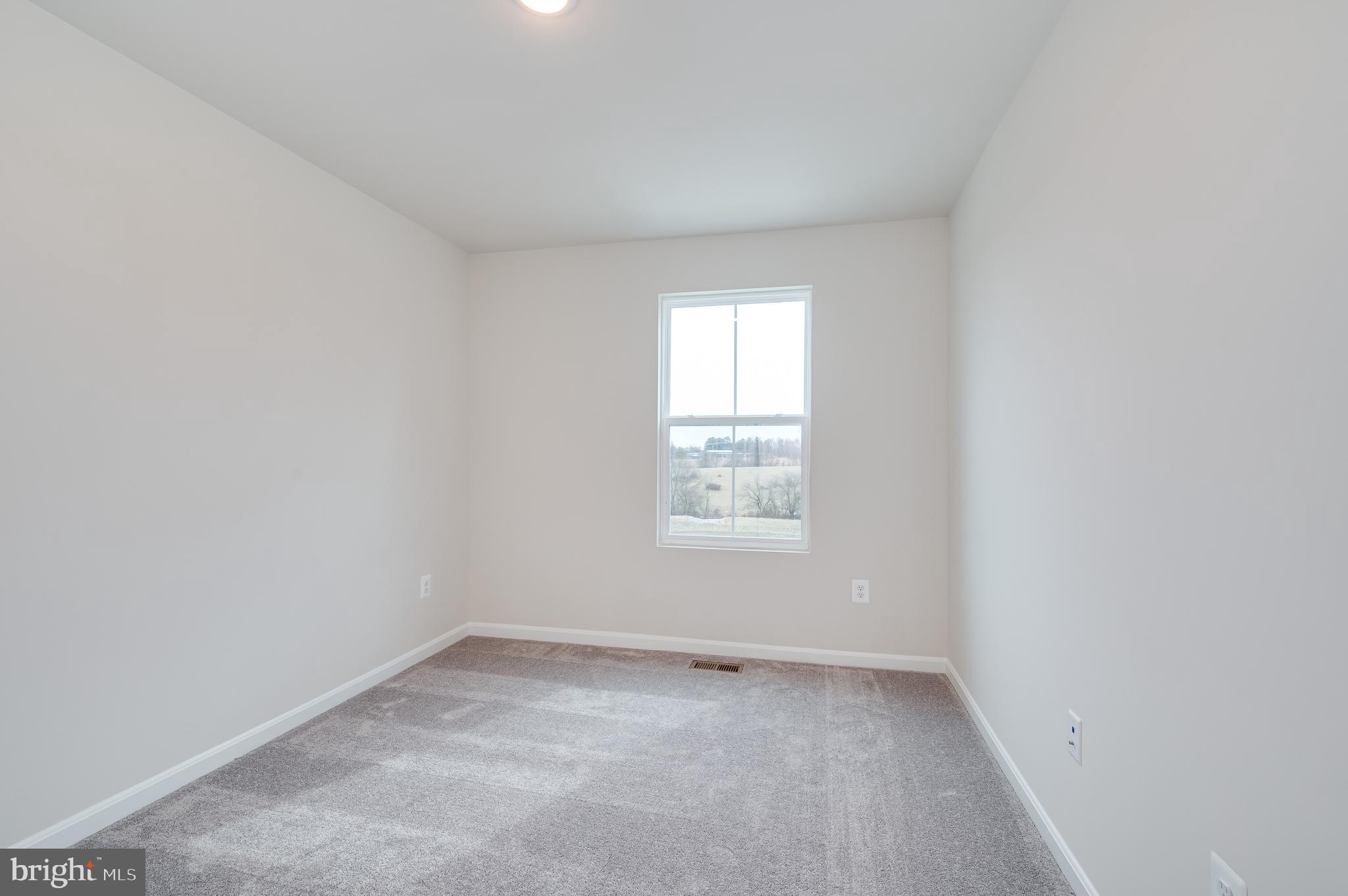 164 Rabbit Road Hedgesville, WV 25427 - Photo 38 of 42 an empty room with a window