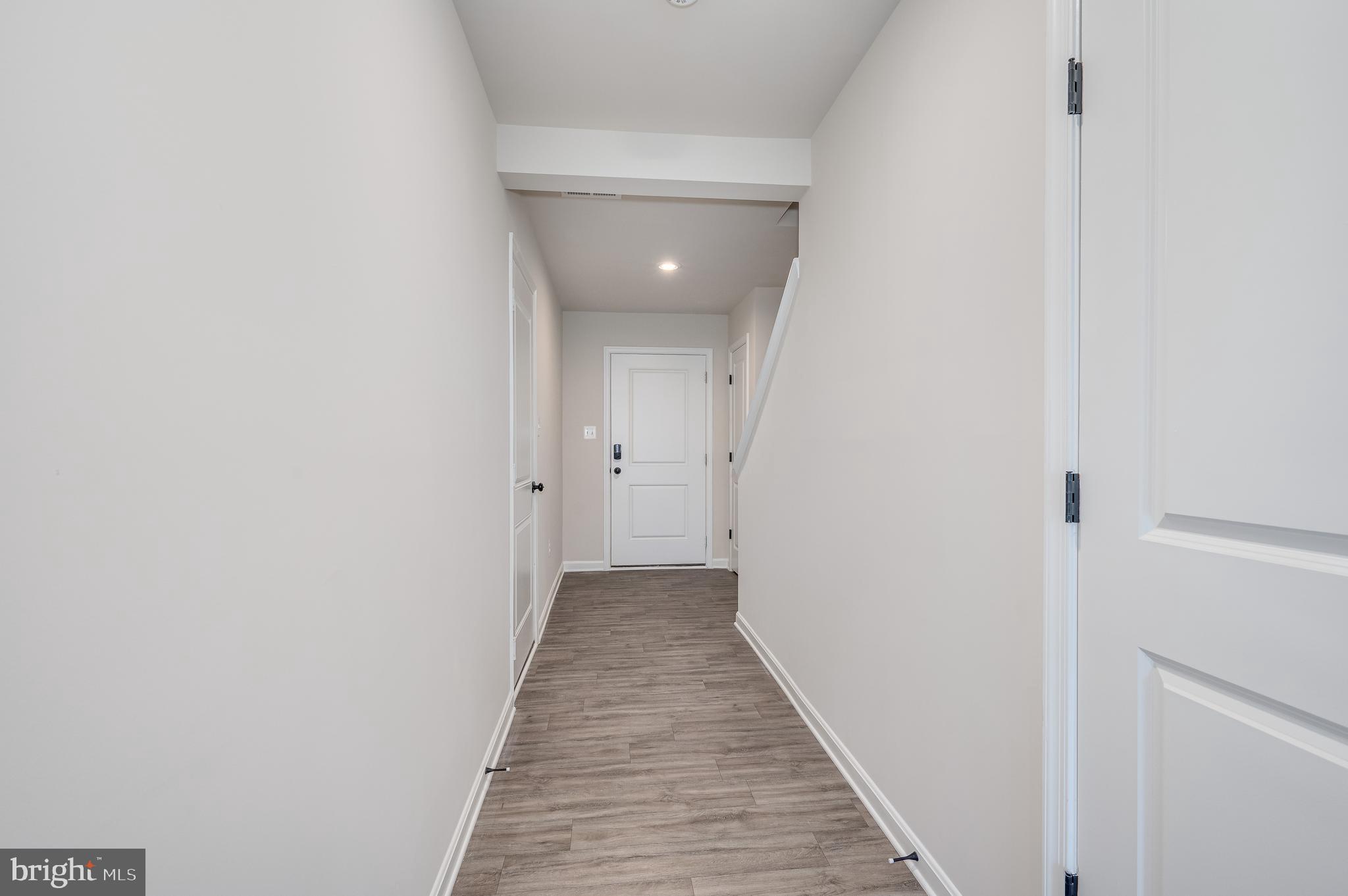 164 Rabbit Road Hedgesville, WV 25427 - Photo 8 of 42 a view of a hallway with wooden floor