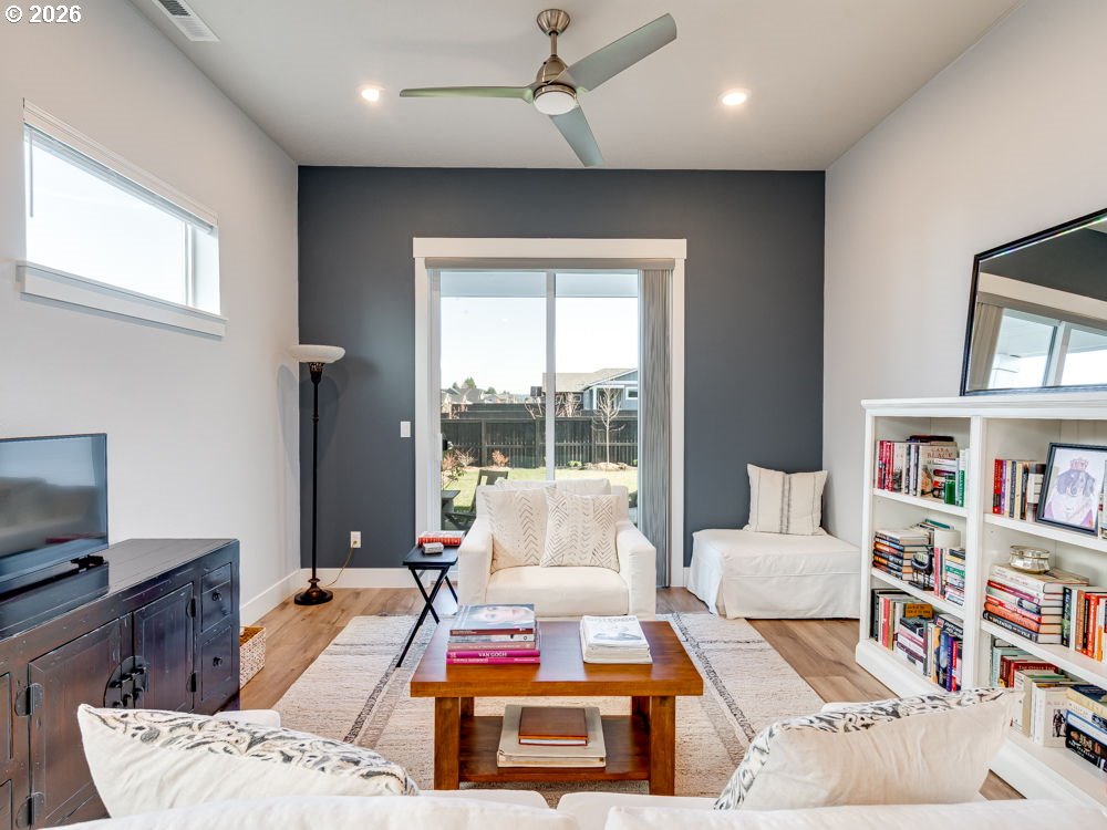 1608 South Fern Way Canby, OR 97013 - Photo 22 of 39 a living room with furniture and a flat screen tv