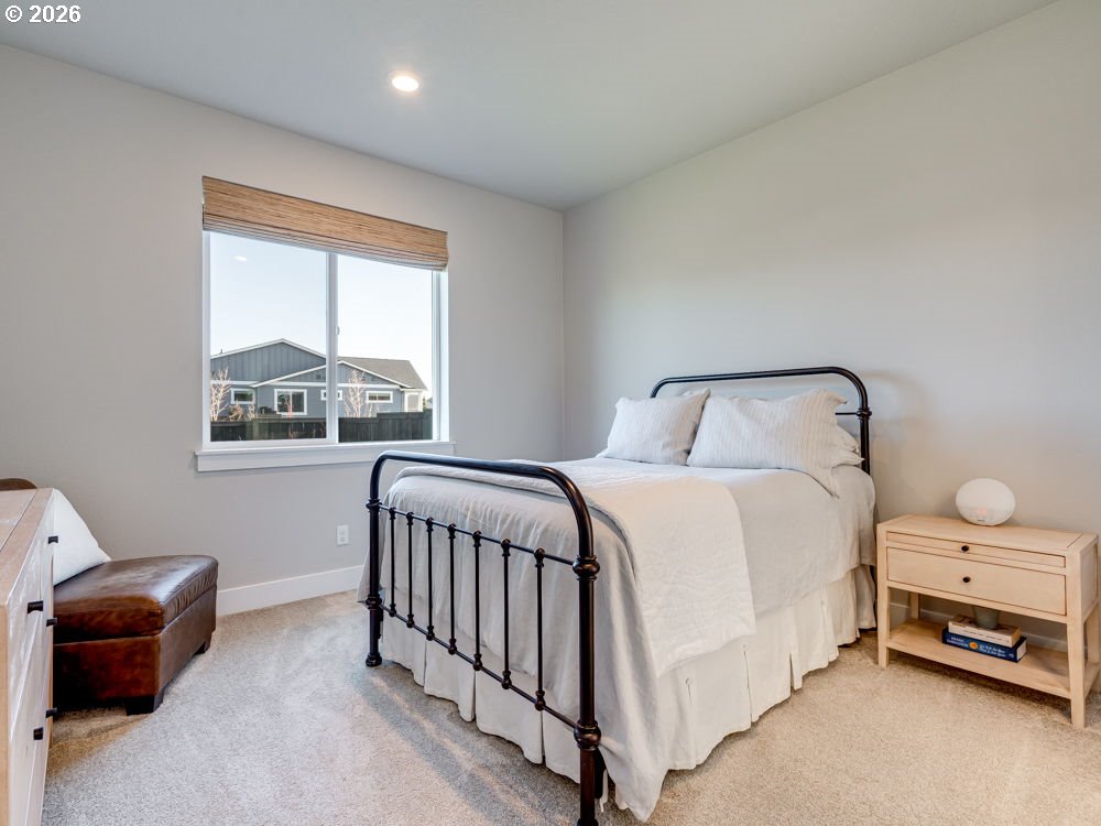 1608 South Fern Way Canby, OR 97013 - Photo 27 of 39 a bedroom with a bed and a window