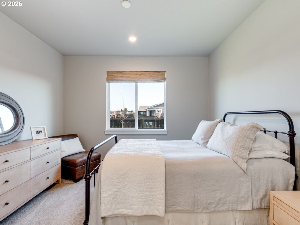 1608 South Fern Way Canby, OR 97013 - Photo 29 of 39 a bedroom with a bed and a window