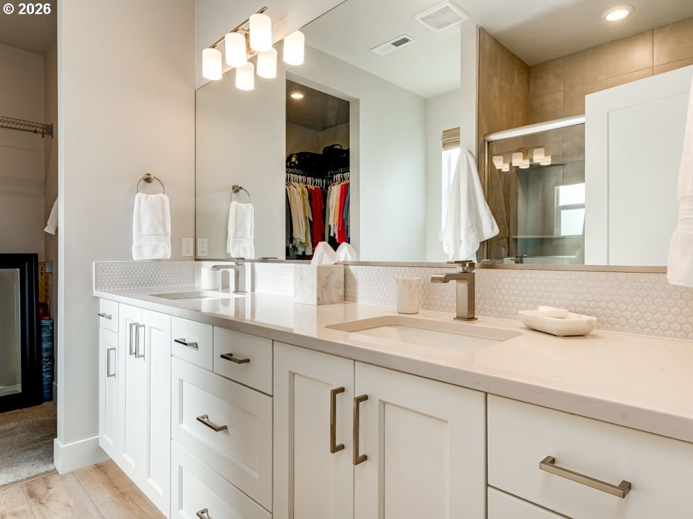 1608 South Fern Way Canby, OR 97013 - Photo 30 of 39 a bathroom with double vanity and a mirror