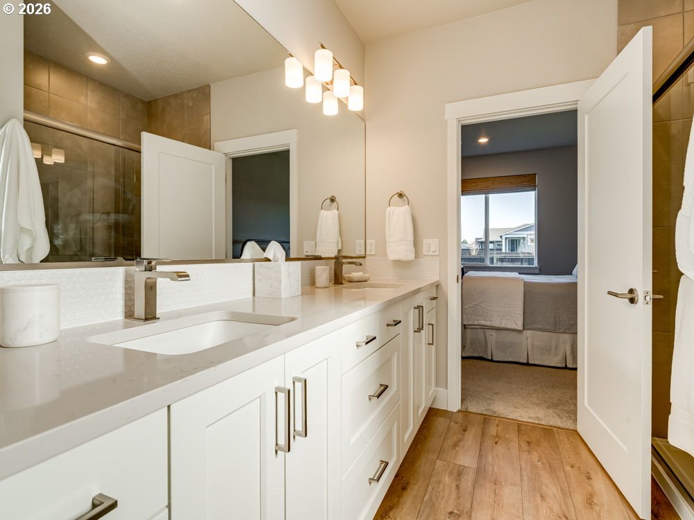 1608 South Fern Way Canby, OR 97013 - Photo 31 of 39 a bathroom with a double vanity sink and a mirror