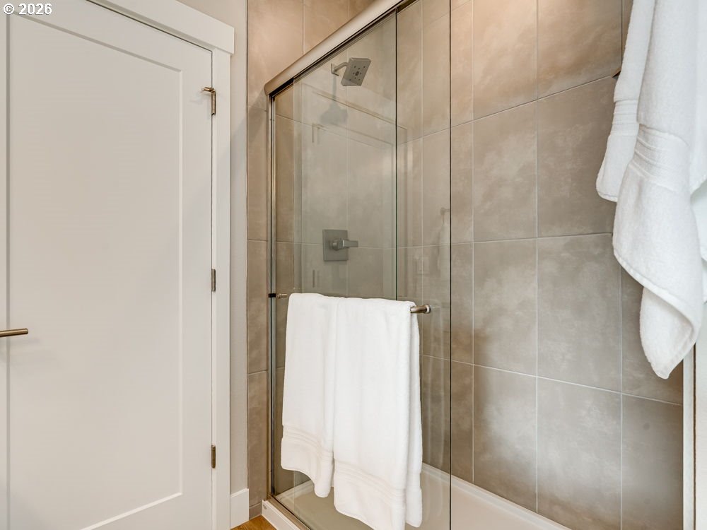 1608 South Fern Way Canby, OR 97013 - Photo 32 of 39 a bathroom with a shower and a glass door