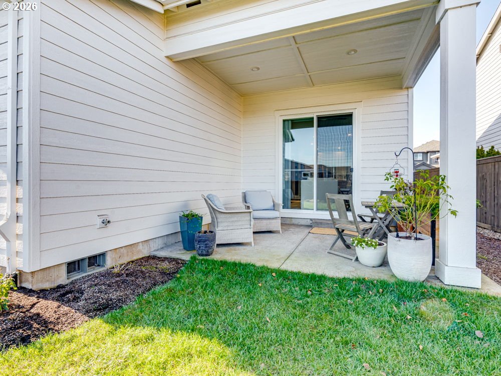 1608 South Fern Way Canby, OR 97013 - Photo 36 of 39 a view of a backyard with chairs and potted plants