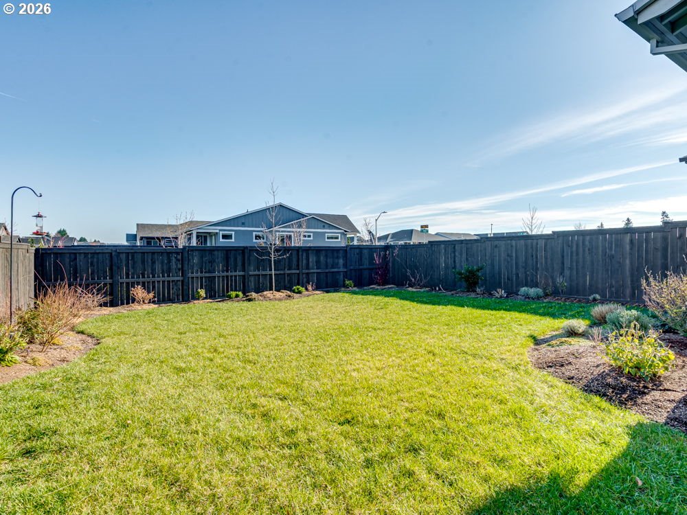 1608 South Fern Way Canby, OR 97013 - Photo 38 of 39 a view of back yard with an outdoor space