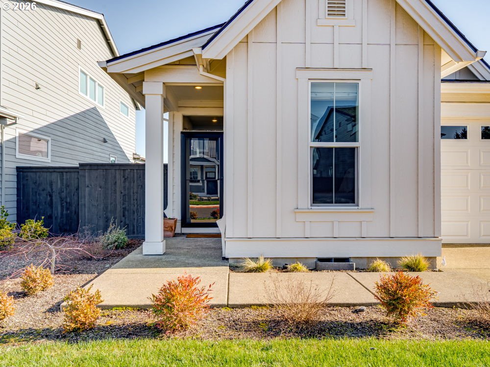 1608 South Fern Way Canby, OR 97013 - Photo 5 of 39 a front view of a house with a yard