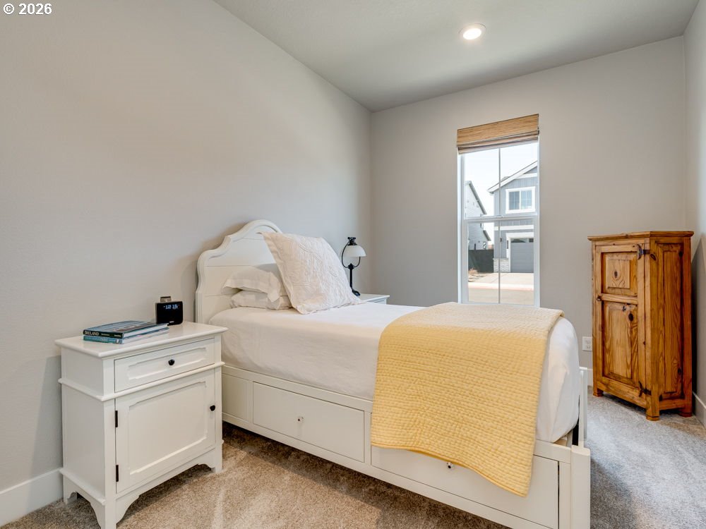 1608 South Fern Way Canby, OR 97013 - Photo 9 of 39 a room with a bed and a window