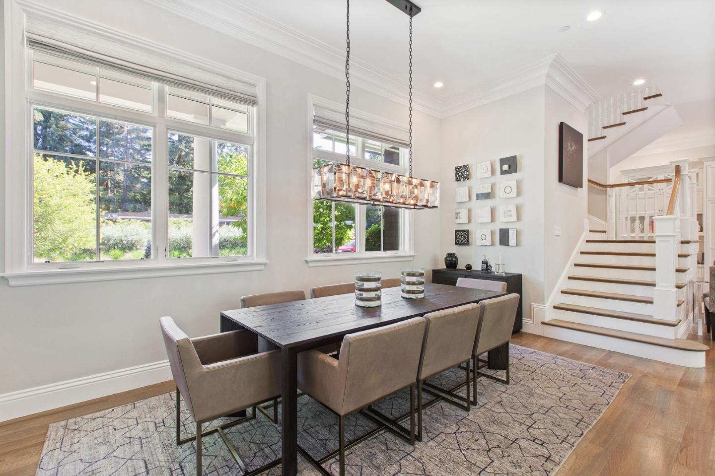 250 Bridge Road Hillsborough, CA 94010 - Photo 15 of 80 a dining room with furniture a chandelier and wooden floor