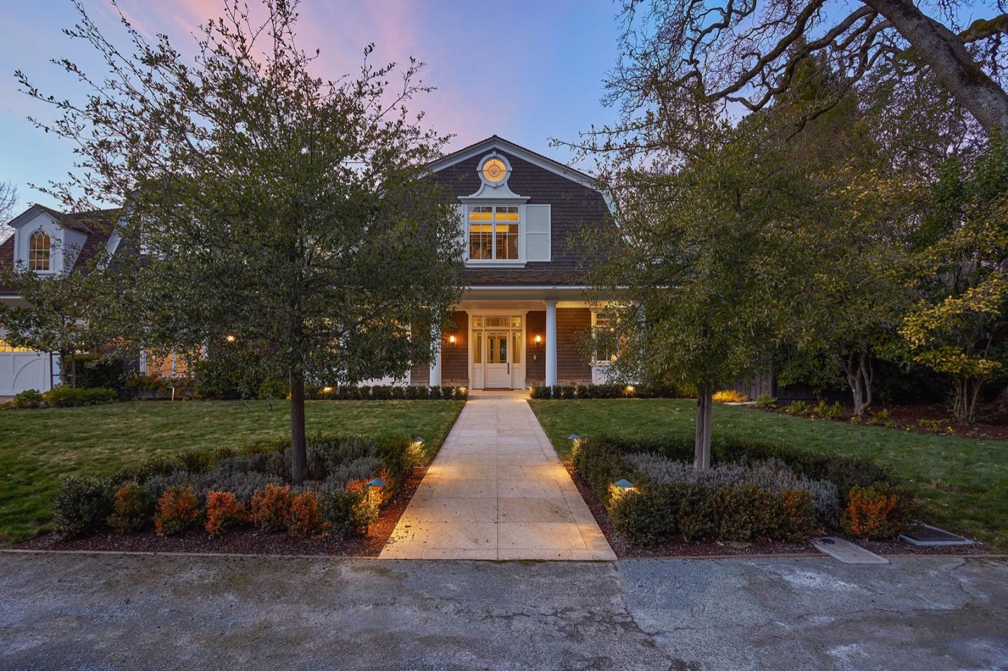 250 Bridge Road Hillsborough, CA 94010 - Photo 2 of 80 a view of a brick house with a yard and large trees