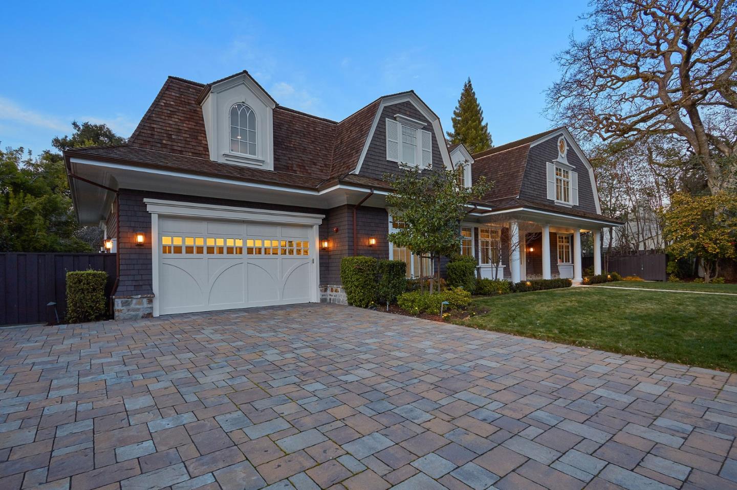 250 Bridge Road Hillsborough, CA 94010 - Photo 3 of 80 a front view of a house with a yard and a garage