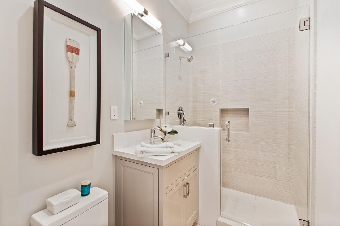 250 Bridge Road Hillsborough, CA 94010 - Photo 36 of 80 a bathroom with a sink a toilet and mirror