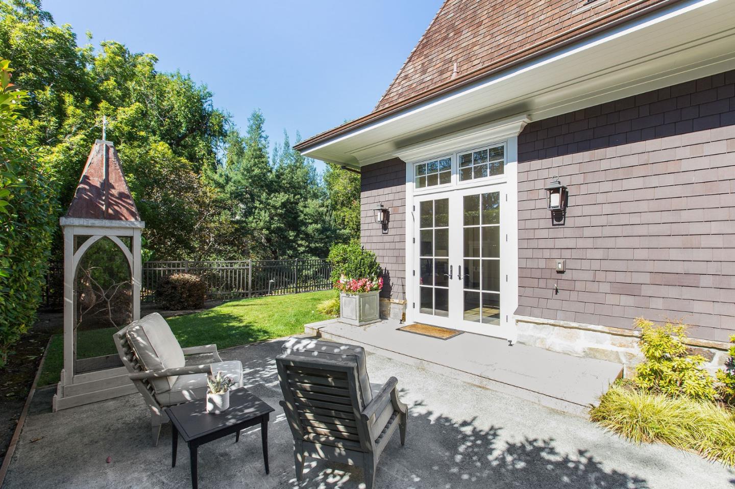 250 Bridge Road Hillsborough, CA 94010 - Photo 53 of 80 a front view of a house with garden and porch