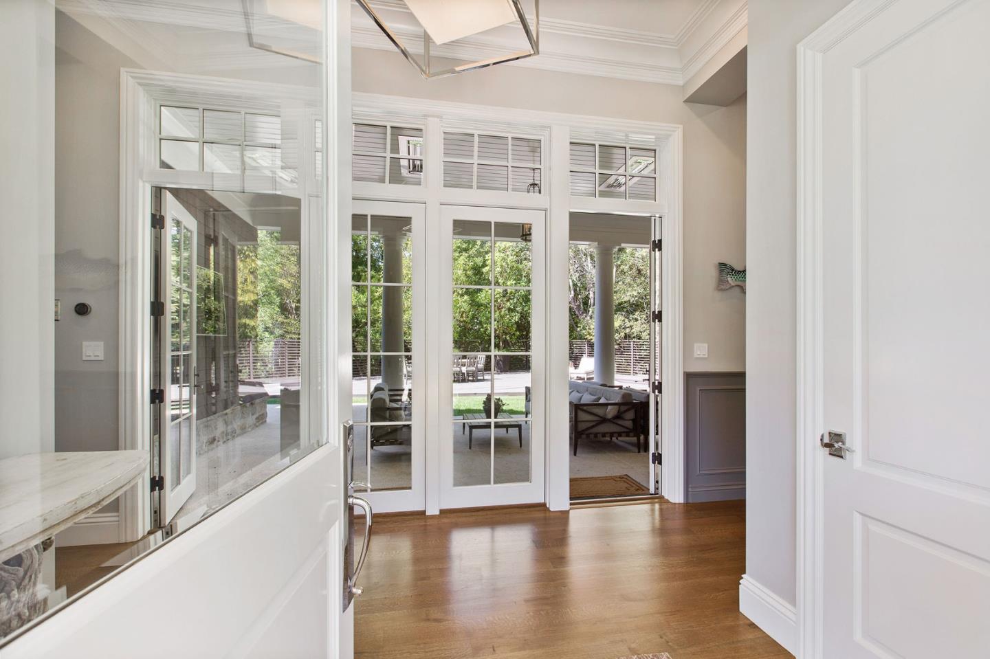 250 Bridge Road Hillsborough, CA 94010 - Photo 7 of 80 a view of an entryway with wooden floor and windows