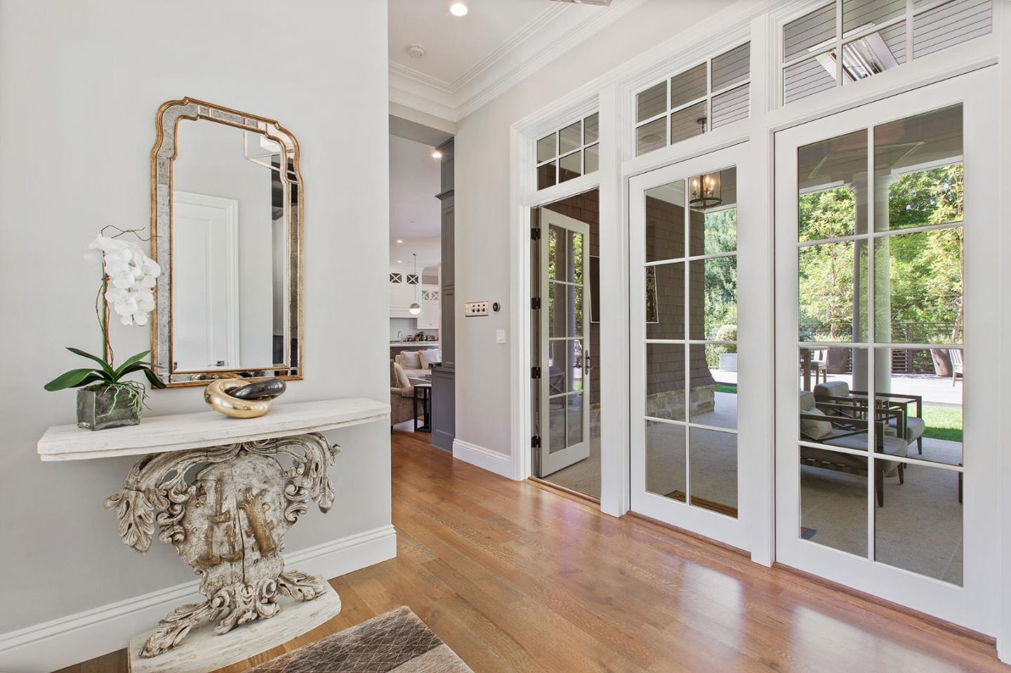 250 Bridge Road Hillsborough, CA 94010 - Photo 8 of 80 a view of a hallway with wooden floor and a bathroom