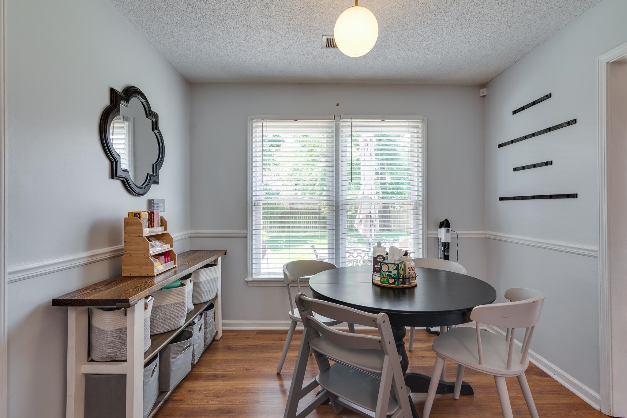 8703 Old River Road Memphis, TN 38018 - Photo 16 of 31 Dining room featuring a textured ceiling and wood finished floors