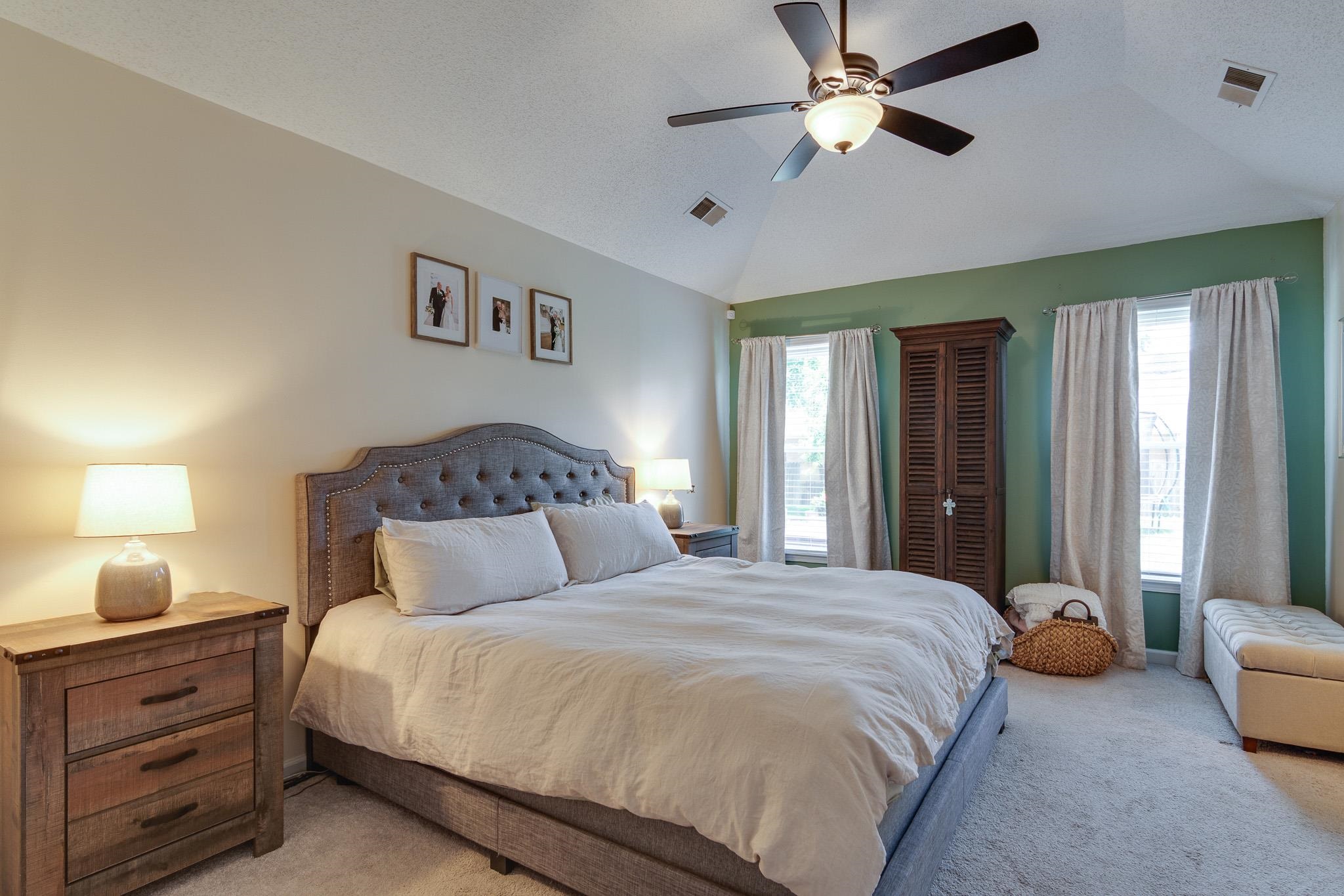 8703 Old River Road Memphis, TN 38018 - Photo 18 of 31 Bedroom with light carpet, lofted ceiling, and a ceiling fan