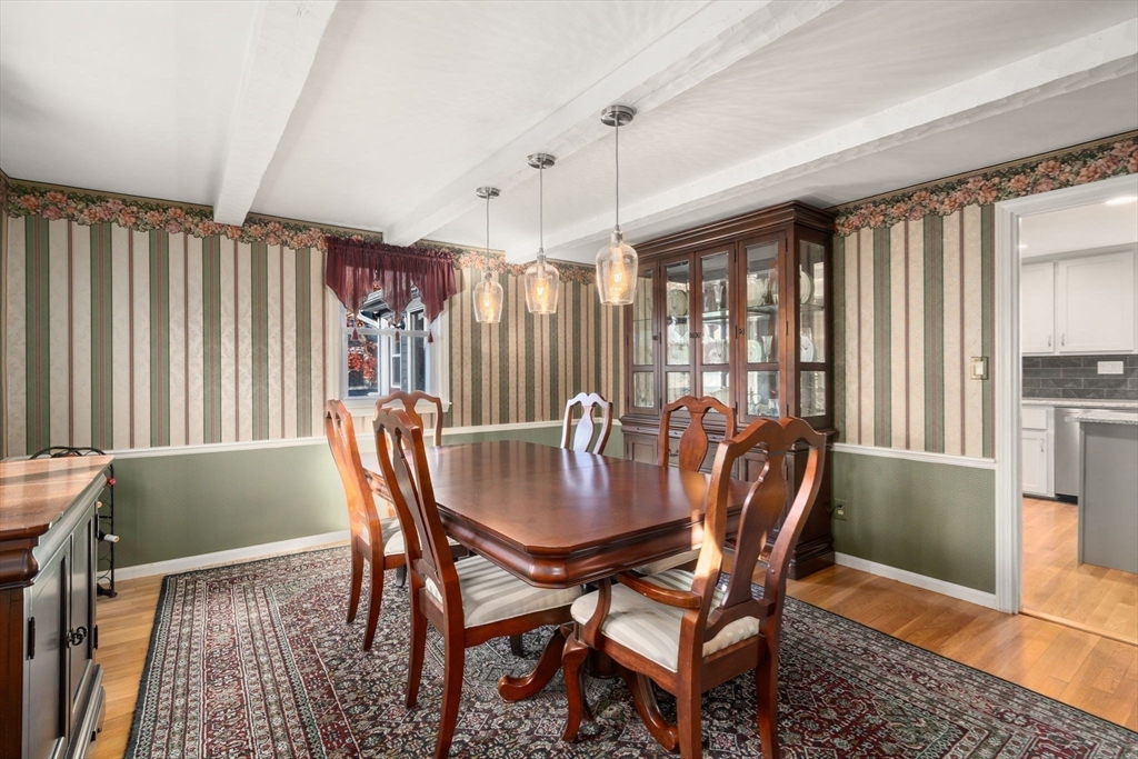 102 Montgomery Avenue Lowell, MA 01851 - Photo 12 of 40 a view of a dining room with furniture window and wooden floor