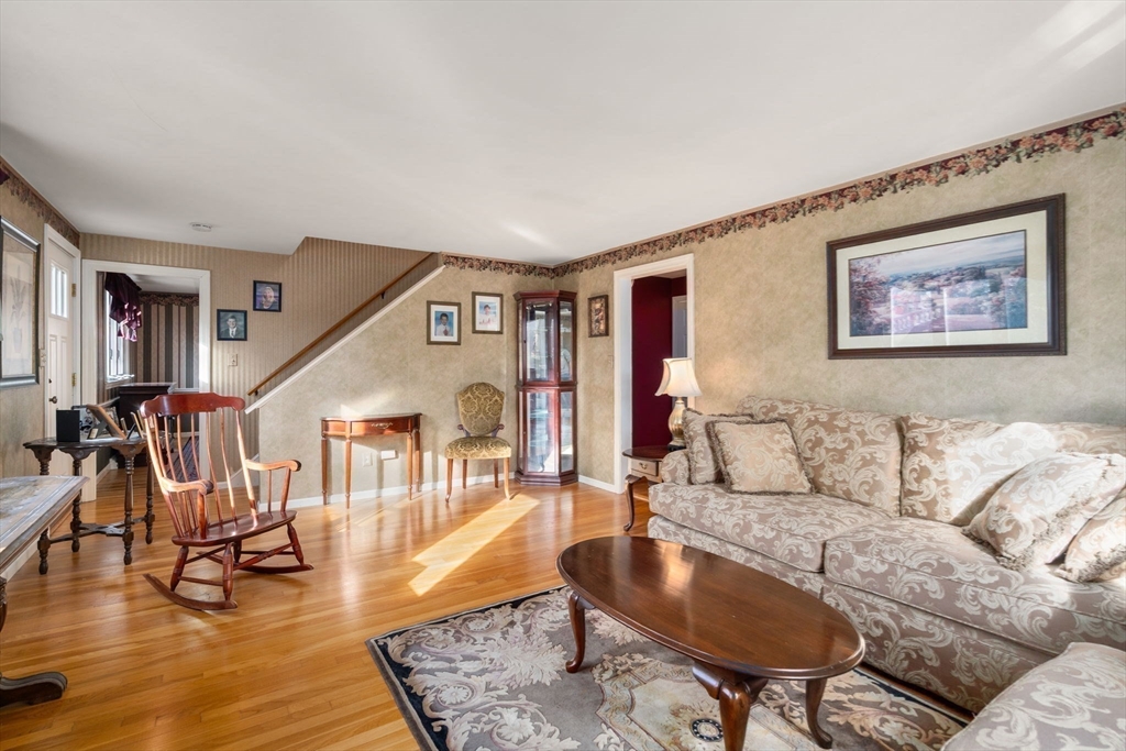 102 Montgomery Avenue Lowell, MA 01851 - Photo 17 of 40 a living room with furniture and wooden floor