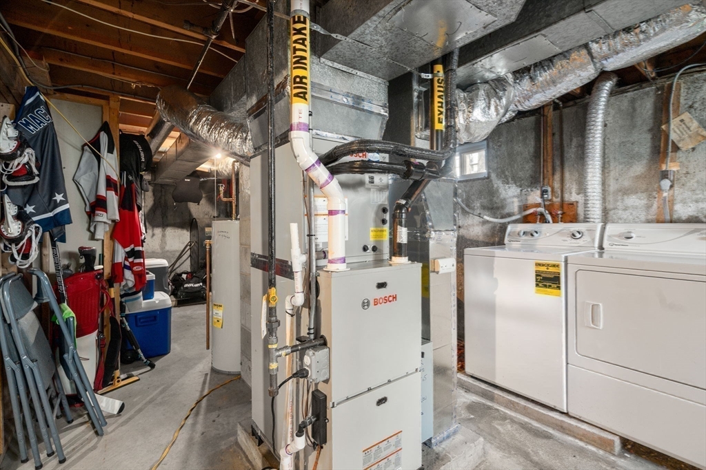 102 Montgomery Avenue Lowell, MA 01851 - Photo 33 of 40 a utility room with dryer and washer