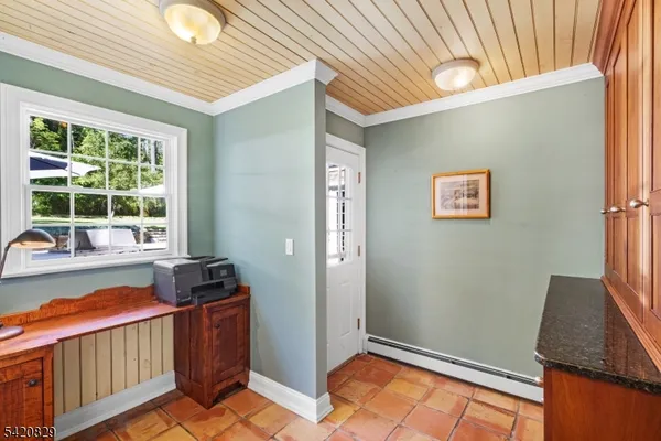 a bathroom with a granite countertop bathtub and sink