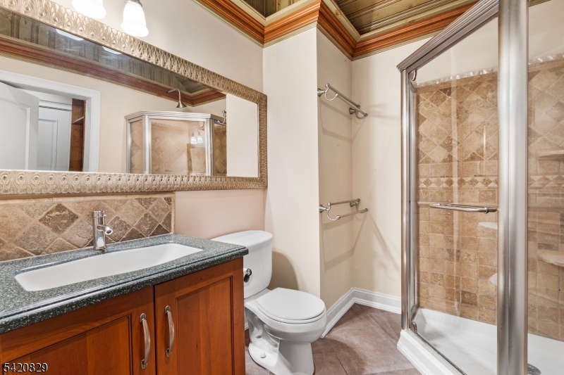 3 Laurel Lane Chester, NJ 07930 - Photo 23 of 37 a bathroom with a sink a toilet and shower