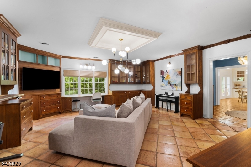 3 Laurel Lane Chester, NJ 07930 - Photo 29 of 37 a living room with furniture a flat screen tv and a large window