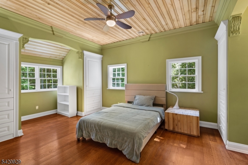 3 Laurel Lane Chester, NJ 07930 - Photo 30 of 37 a bedroom with a bed and wooden floor