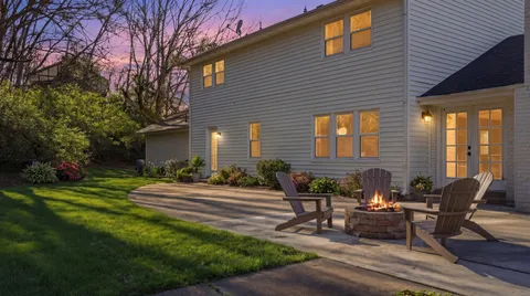 a view of a a dining room with furniture window and wooden floor