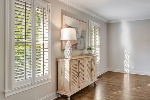a bathroom with double vanity sinks and a mirror