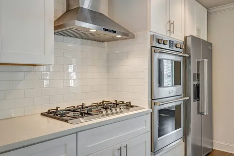 a bathroom with a bathtub and shower