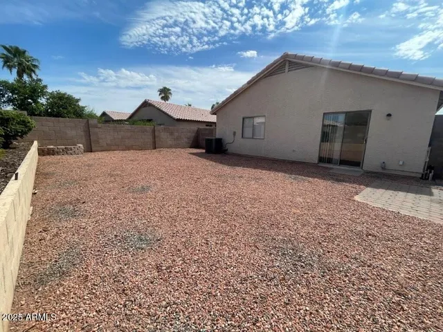 a view of a backyard of a house
